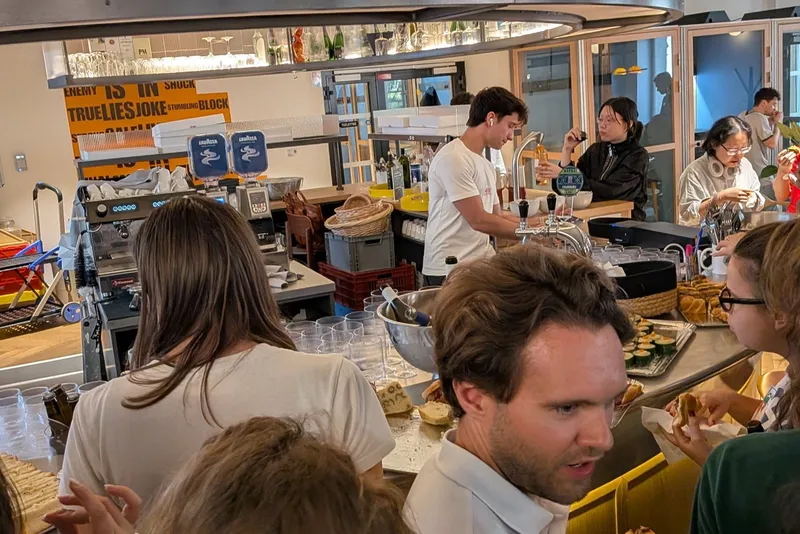 Participants at the bar between two work sessions
