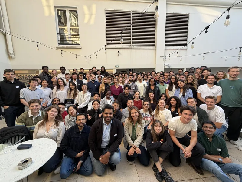 Group photo of the LLM x Law Hackathon participants in the courtyard