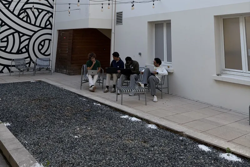 The Lexora team coding in the courtyard